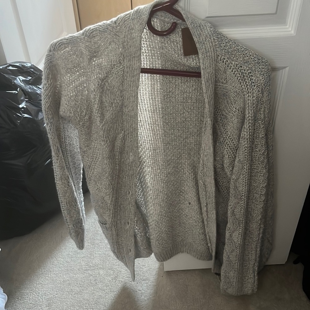 Grey again from the brand Canadian never been worn before